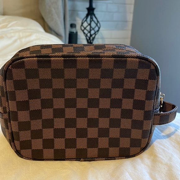 Handbags - New checkered cosmetic pouch.